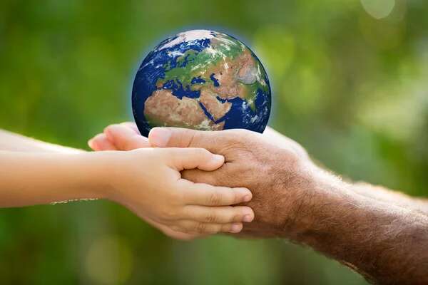 depositphotos_41752487-stock-photo-child-and-man-holding-earth